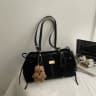 Black strap with charm