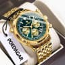 960 gold case with green dial and steel strap